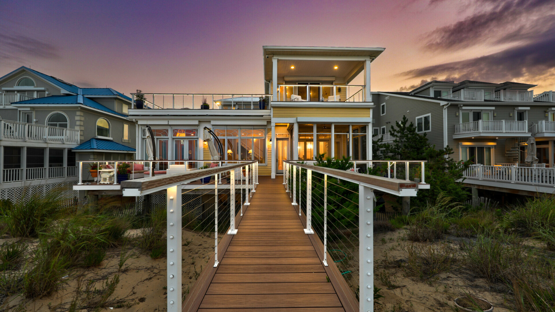 Rear view of modern custom home at dusk, Rehoboth Beach DE