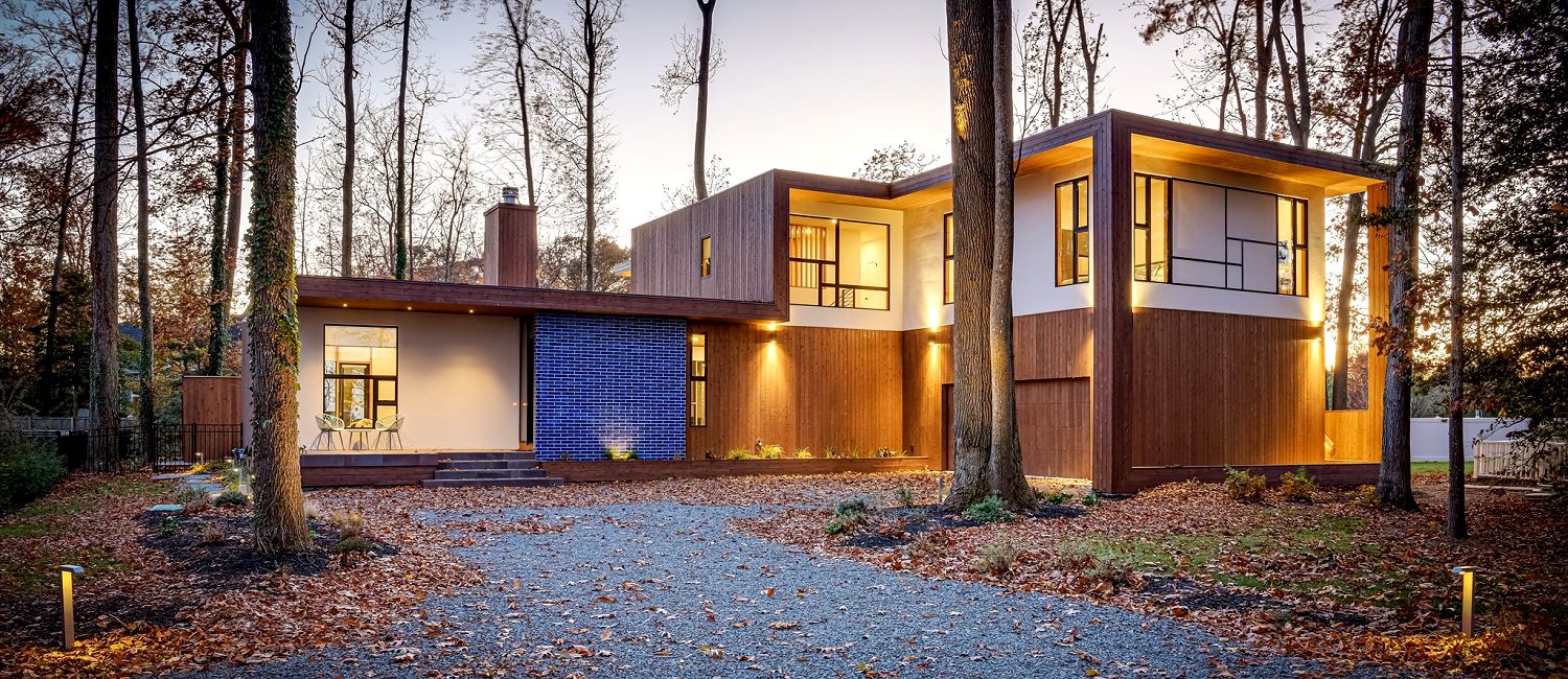Front view of luxury modern home boasting a custom treehouse in the back, Rehoboth Beach DE