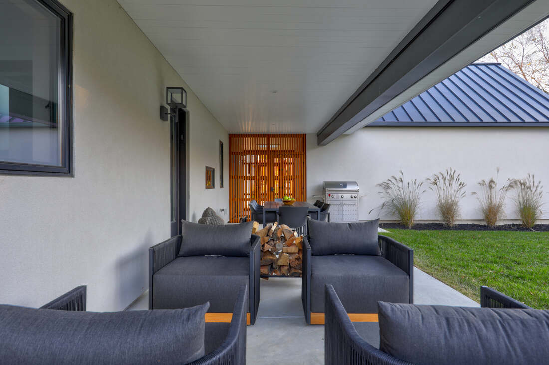 Screened cedar porch at a Bayberry Dunes coastal home near the water