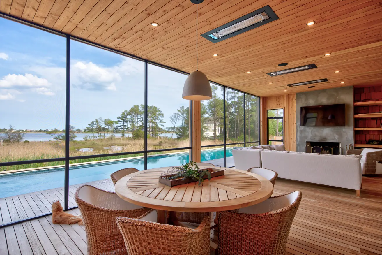Open living and dining room with water views in a Bay Pines custom home