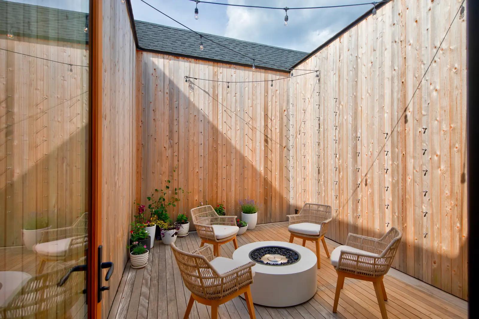 Deck lounge and outdoor living space at a Bay Pines custom home