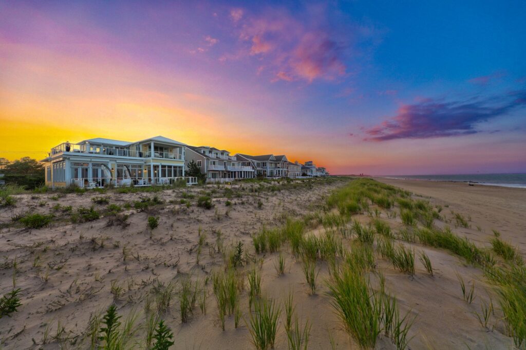 Oceanfront custom homes at twilight on the Delaware coast, built by CRx Construction