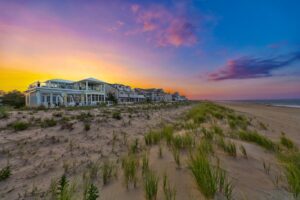 Oceanfront custom homes at twilight on the Delaware coast, built by CRx Construction