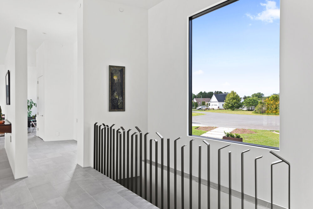 Deck lounge and outdoor living space at a Breakwater custom home