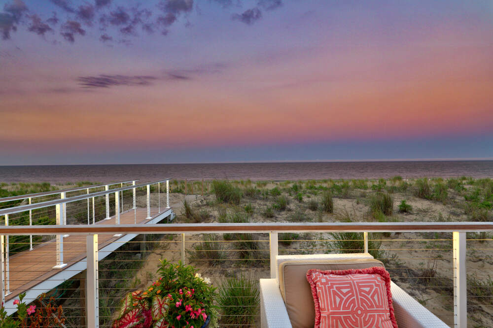 Deck lounge and outdoor living space at a Rehoboth by the Sea custom home