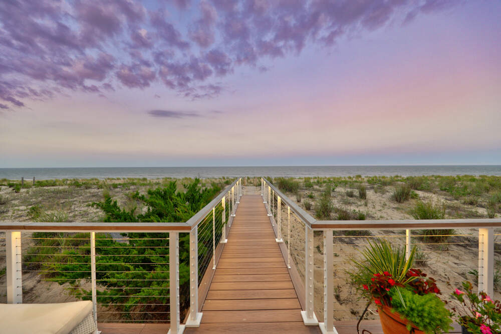 Screened cedar porch at a Rehoboth by the Sea coastal home near the water