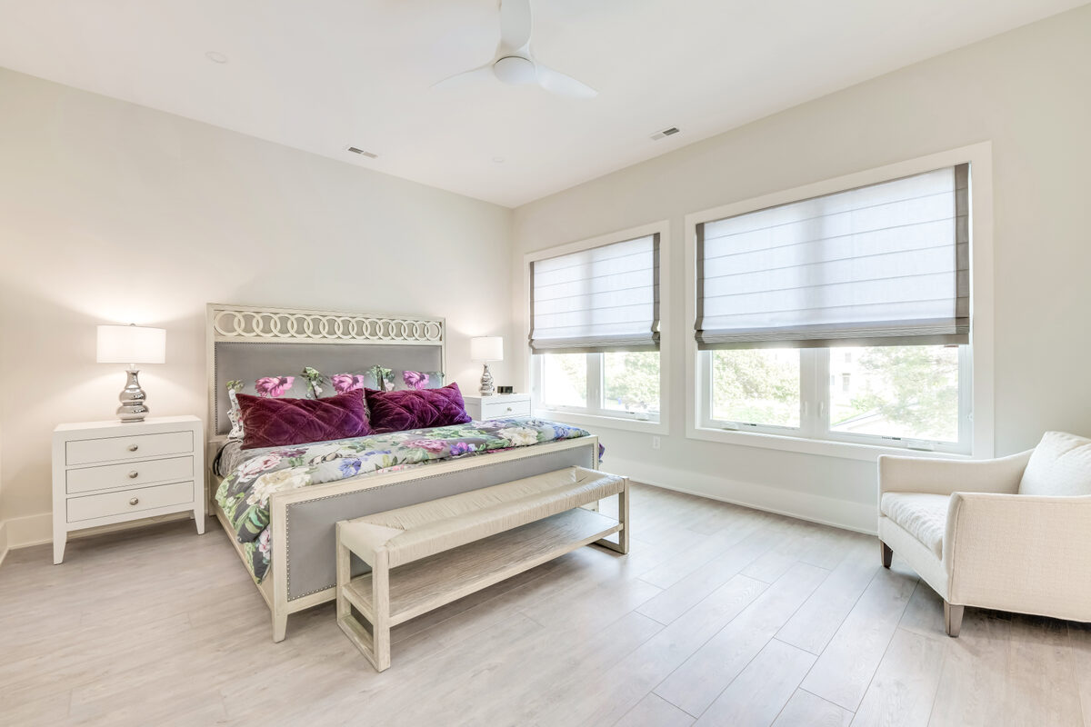 Open living and dining room with water views in a Seabreeze custom home