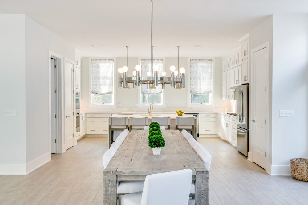 Coastal custom home exterior in Seabreeze showing its lot and setting