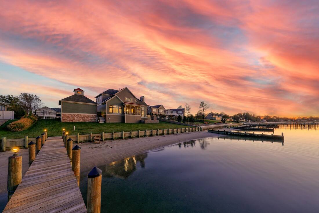 Coastal custom home exterior in Henlopen Acres showing its lot and setting