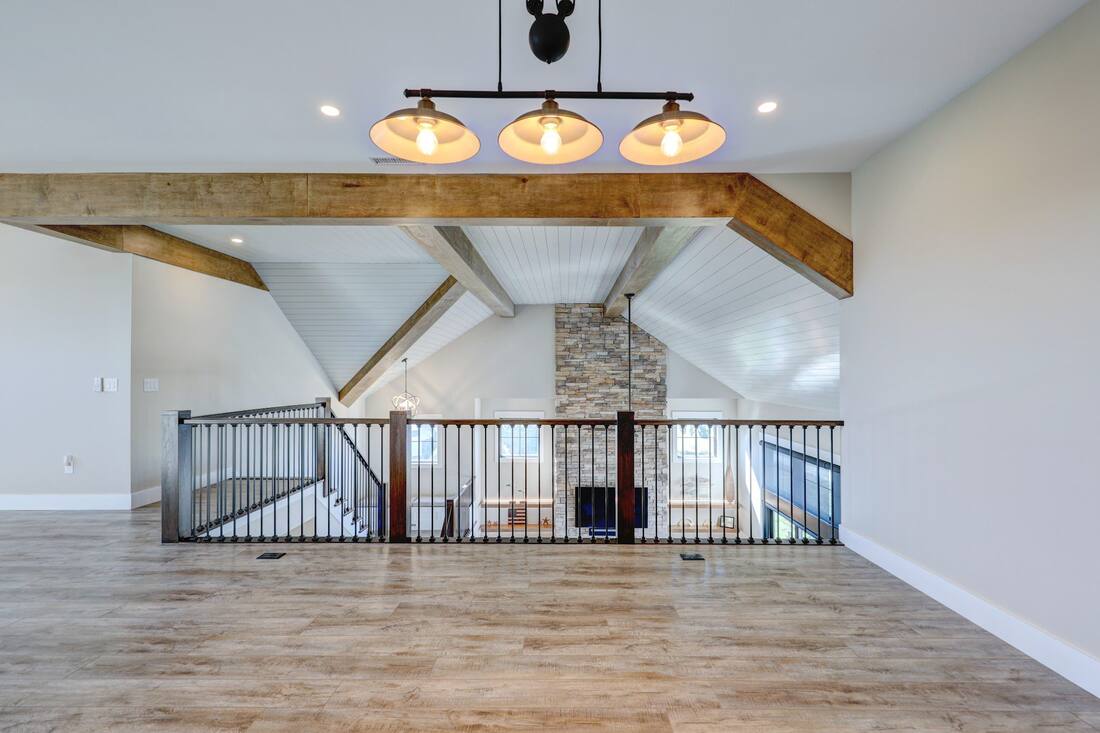 Open living and dining room with water views in a Henlopen Acres custom home
