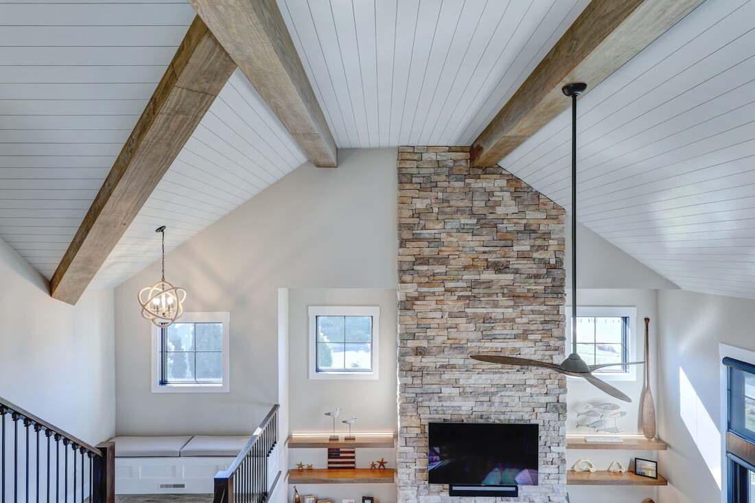 Screened cedar porch at a Henlopen Acres coastal home near the water