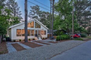 Renovated coastal cottage at twilight after a home remodeling project in Dewey Beach by CRx Construction