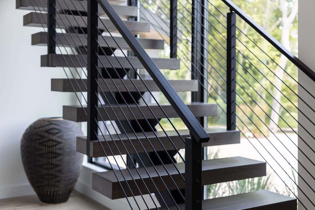 Screened cedar porch at a Lewes coastal home near the water