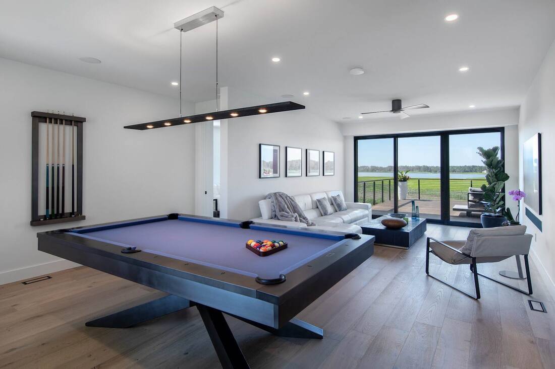 Coastal custom home exterior in Lewes showing its lot and setting
