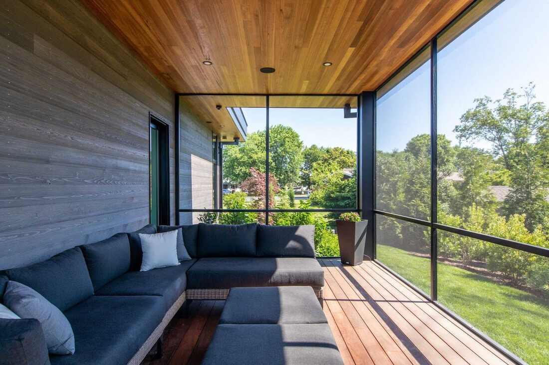 Elevated screened deck at a Lewes coastal home