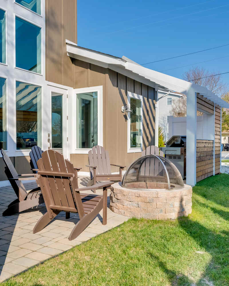 Screened cedar porch at a North Rehoboth coastal home near the water