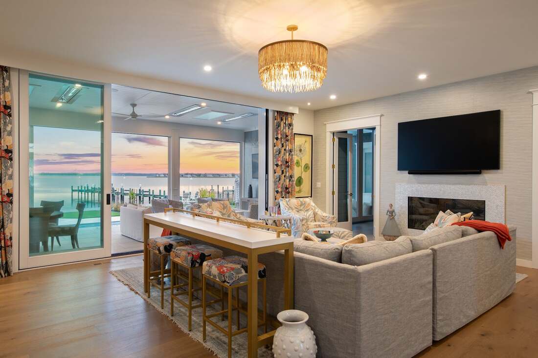 Open living and dining room with water views in a North Shores custom home