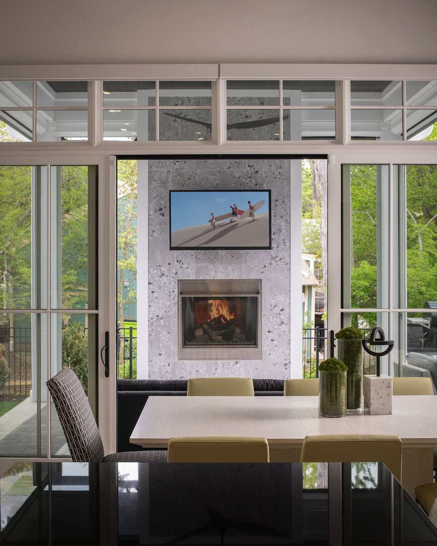 Open living and dining room with water views in a Rehoboth Beach Yacht & Country Club custom home