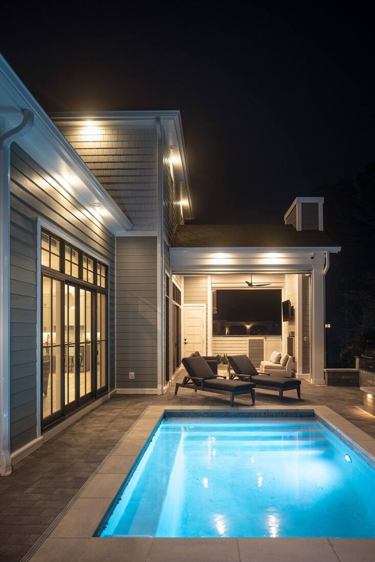 Coastal custom home exterior in Rehoboth Beach Yacht & Country Club showing its lot and setting