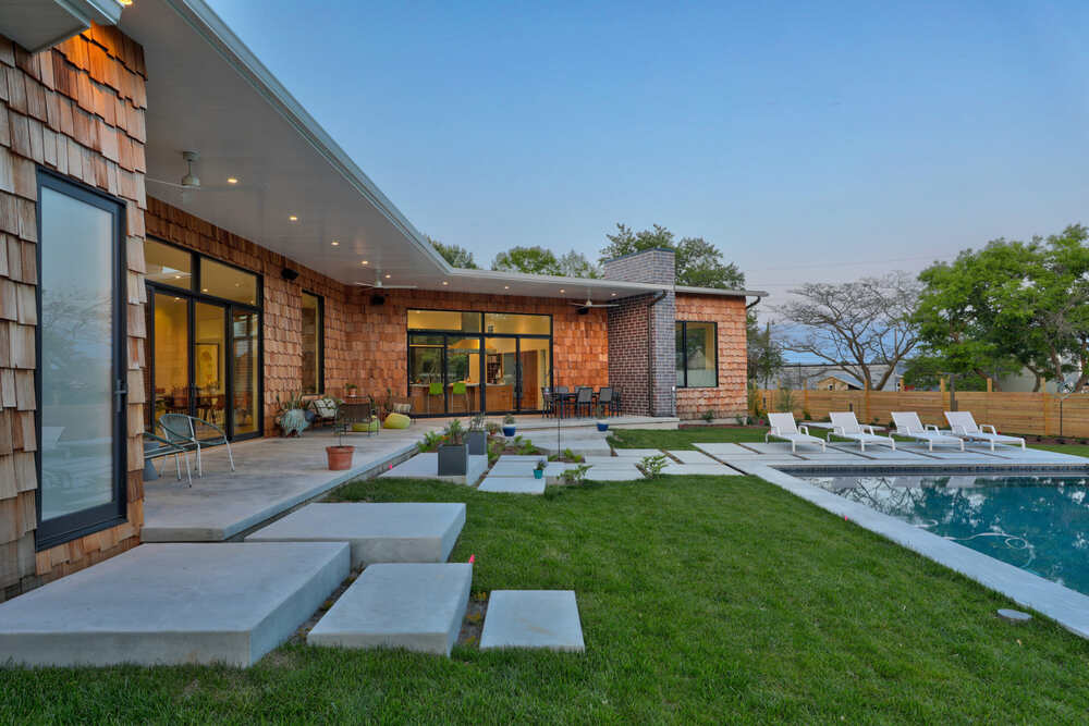 Screened cedar porch at a coastal home in The Curves near the water